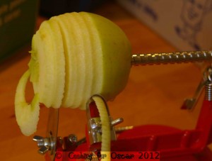 Peeling, coring and slicing apples.