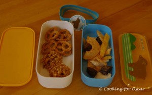 Snack Box with pretzels, cereal bites and dried fruit.